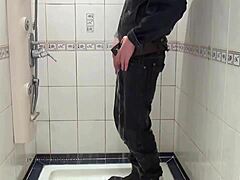 A man in blue jeans takes a bath and grooms himself