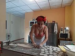Temptress Regina Noir dominates her submissive slave in the kitchen