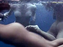 Lesbian threesome in the sea with small ass and tight pussies