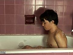 Young man pleasures himself in a steamy bath