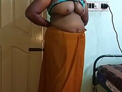 Desi housewife reveals her big tits and shaved pussy in arousing solo session